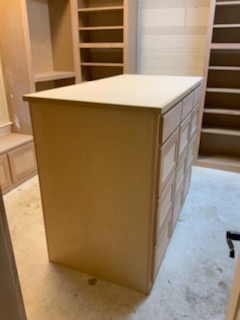 center cabinet of drawers in custom closet